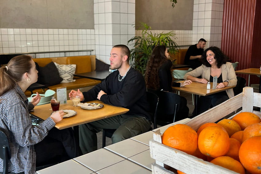 Share Stories in Hostels or Cafés